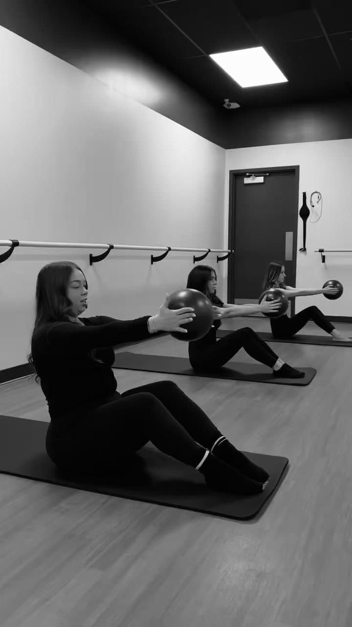 Mat pilates class with stability balls